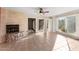 Open living area with tile floors and a stone fireplace at 7319 E Rose Ln, Scottsdale, AZ 85250