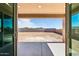 Backyard view of a blank lot with partial block fencing and mountain views at 7662 W Rowel Rd, Peoria, AZ 85383