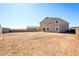 A large, open backyard with new construction home, offering endless possibilities for customization at 7662 W Rowel Rd, Peoria, AZ 85383