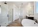 Elegant bathroom featuring a soaking tub and walk-in shower at 7662 W Rowel Rd, Peoria, AZ 85383