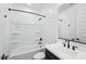 Modern bathroom features a shower-tub combo and sleek vanity at 7662 W Rowel Rd, Peoria, AZ 85383