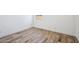 Bedroom featuring wood-look floors, white walls, and a window view at 7662 W Rowel Rd, Peoria, AZ 85383
