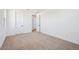 Bright bedroom has carpet flooring, white walls, trim and doors, and a walk-in closet at 7662 W Rowel Rd, Peoria, AZ 85383