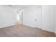 Bright bedroom features neutral carpet, white walls, and modern doors at 7662 W Rowel Rd, Peoria, AZ 85383