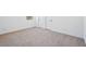 Light and airy bedroom with neutral carpet, white walls and doors and ample living space at 7662 W Rowel Rd, Peoria, AZ 85383