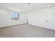 Bright bedroom with large window and neutral carpet flooring at 7662 W Rowel Rd, Peoria, AZ 85383