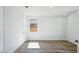 Bright bedroom with wood-look floors, neutral walls, recessed lighting, and two doors at 7662 W Rowel Rd, Peoria, AZ 85383