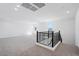 Large bonus room features neutral carpet, white walls and natural light from two windows at 7662 W Rowel Rd, Peoria, AZ 85383