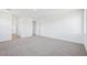 Spacious bonus room with neutral carpeting, recessed lighting, and ample natural light at 7662 W Rowel Rd, Peoria, AZ 85383