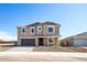 Lovely home featuring a landscaped front yard, a two-car garage, and a welcoming front porch at 7662 W Rowel Rd, Peoria, AZ 85383