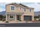 Two-story house with a large garage and desert landscaping at 7662 W Rowel Rd, Peoria, AZ 85383