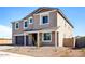 Attractive two-story home boasting a neatly landscaped yard, an attached garage, and a welcoming facade at 7662 W Rowel Rd, Peoria, AZ 85383