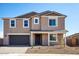 Charming two-story home showcasing a well-manicured front yard and an attached two-car garage at 7662 W Rowel Rd, Peoria, AZ 85383
