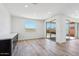Bright flex room with wood-look floors, recessed lighting, views, and access to the backyard at 7662 W Rowel Rd, Peoria, AZ 85383