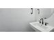 Stylish powder room features a modern sink and dark fixtures at 7662 W Rowel Rd, Peoria, AZ 85383