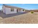 Spacious backyard with gravel landscaping and covered patio at 8026 W Wood Ln, Phoenix, AZ 85043