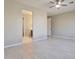 Large bedroom with ceiling fan and bathroom access at 8026 W Wood Ln, Phoenix, AZ 85043