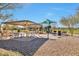 Community park with shaded picnic area and playground at 8026 W Wood Ln, Phoenix, AZ 85043