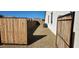 Side yard with gravel and a wooden gate at 8026 W Wood Ln, Phoenix, AZ 85043