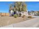 House exterior with landscaped front yard and two-car garage at 8026 W Wood Ln, Phoenix, AZ 85043
