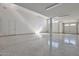 Bright and spacious garage interior with polished concrete floor at 8026 W Wood Ln, Phoenix, AZ 85043
