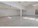 Large garage with polished floor and ample storage space at 8026 W Wood Ln, Phoenix, AZ 85043