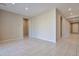 Bright hallway with neutral walls and tile floors at 8026 W Wood Ln, Phoenix, AZ 85043