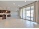 Modern kitchen features dark cabinetry, granite countertops, and a view to the backyard at 8026 W Wood Ln, Phoenix, AZ 85043