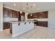 Modern kitchen featuring granite countertops and dark wood cabinetry at 8026 W Wood Ln, Phoenix, AZ 85043