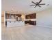 Open concept kitchen with island and Gathering room views at 8026 W Wood Ln, Phoenix, AZ 85043
