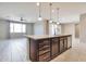 Open concept kitchen with large island and granite countertops at 8026 W Wood Ln, Phoenix, AZ 85043
