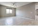 Bright and spacious living room with tile flooring at 8026 W Wood Ln, Phoenix, AZ 85043