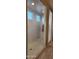 Large walk-in shower with tiled walls and glass enclosure at 8026 W Wood Ln, Phoenix, AZ 85043