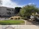 Beautiful desert landscaping accents this cozy condo with mature trees and pool nearby at 9065 E Gary Rd # 124, Scottsdale, AZ 85260