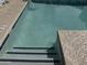 Close up of pool steps with blue tile and hand rail at 9065 E Gary Rd # 124, Scottsdale, AZ 85260