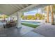 Inviting pool area with covered patio and dining table at 9790 E Caron St, Scottsdale, AZ 85258