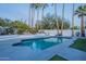 Relaxing kidney-shaped pool with a waterfall feature at 9790 E Caron St, Scottsdale, AZ 85258