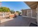 Spacious backyard with patio, covered seating, and mature citrus trees at 9814 W Cedar Dr, Sun City, AZ 85351