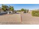 Landscaped backyard with fruit trees and gravel at 9814 W Cedar Dr, Sun City, AZ 85351