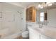 Clean bathroom with shower, toilet, and vanity at 9814 W Cedar Dr, Sun City, AZ 85351