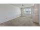 Spacious bedroom with large window and ceiling fan at 9814 W Cedar Dr, Sun City, AZ 85351