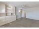 Bedroom with built-in storage and ceiling fan at 9814 W Cedar Dr, Sun City, AZ 85351