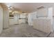Garage interior with cabinets, water heater, and extra storage at 9814 W Cedar Dr, Sun City, AZ 85351