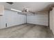 2-car garage with overhead door and built-in storage at 9814 W Cedar Dr, Sun City, AZ 85351