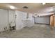 Attached garage with utility sink and ample storage cabinets at 9814 W Cedar Dr, Sun City, AZ 85351