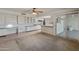 Kitchen with breakfast bar and view of patio at 9814 W Cedar Dr, Sun City, AZ 85351