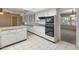 View of kitchen with island and stainless steel appliances at 9814 W Cedar Dr, Sun City, AZ 85351