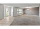 Open living room and entryway with neutral colors and carpet at 9814 W Cedar Dr, Sun City, AZ 85351