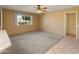 Living room with tiled floor and ceiling fan at 9814 W Cedar Dr, Sun City, AZ 85351