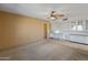 Living room with built-in desk and kitchen view at 9814 W Cedar Dr, Sun City, AZ 85351